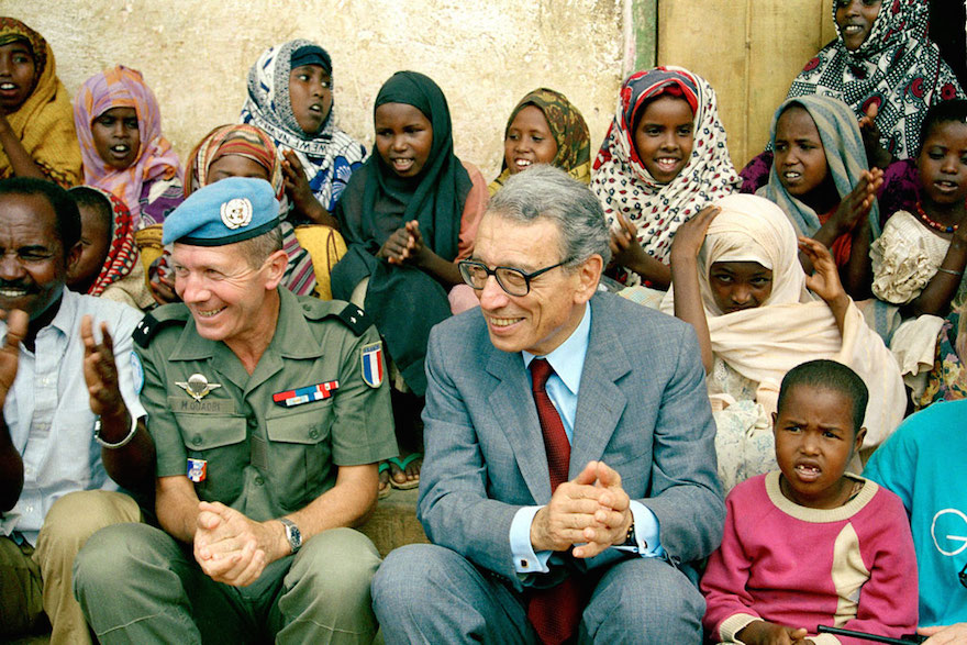 On a visit to Somalia in October 1993, Boutros-Ghali visits with young residents of a UN-supported orphanage in Baidoa, accompanied by Brigadier General Maurice Quadri, Commander of the French contingent of the Second UN Mission in Somalia. UN Photo/Fabrice Ribère