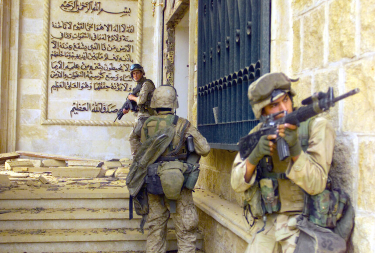 Photo: U.S. Marines from 1st Battalion 7th Marines enter a palace during the Fall of Baghdad. Credit: Wikimedia Commons
