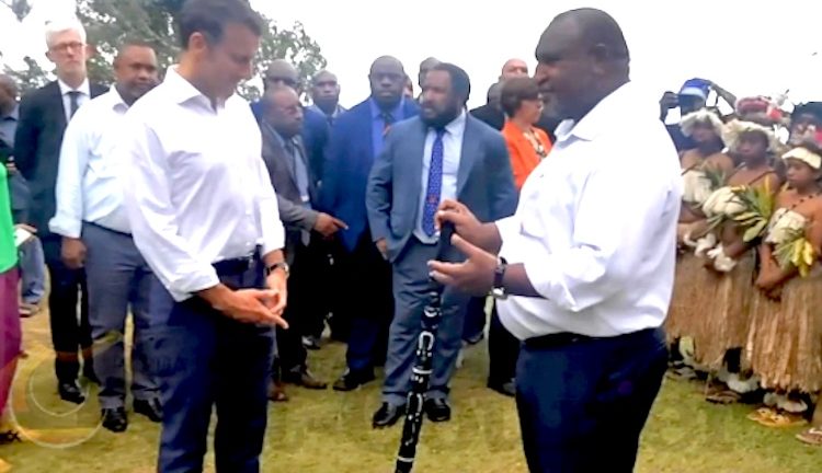 Prime Minister James Marape presenting a traditional eagle wooden spear with totems to French President Emmanuel Macron at Varirata Park today as a symbol of friendship. Image: PNG Post-Courier.