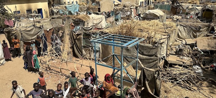 aerial_view_of_childrem_near_temporary_shelters.jpg